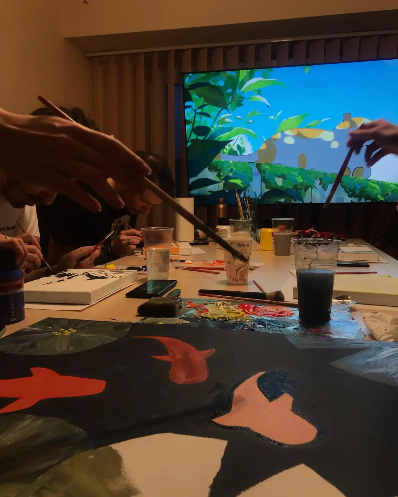 Brushes and canvases up close on paint night