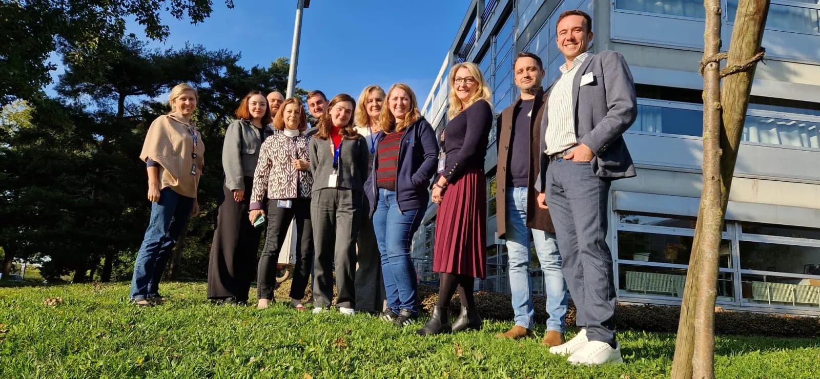 The Tribus team gathered outside the office on a sunny day